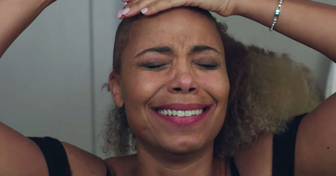 Still from 'Nappily Ever After' of a woman shaving her head and crying