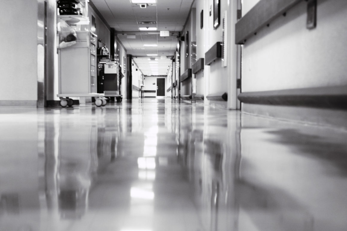 Black and white view of a hospital hallway